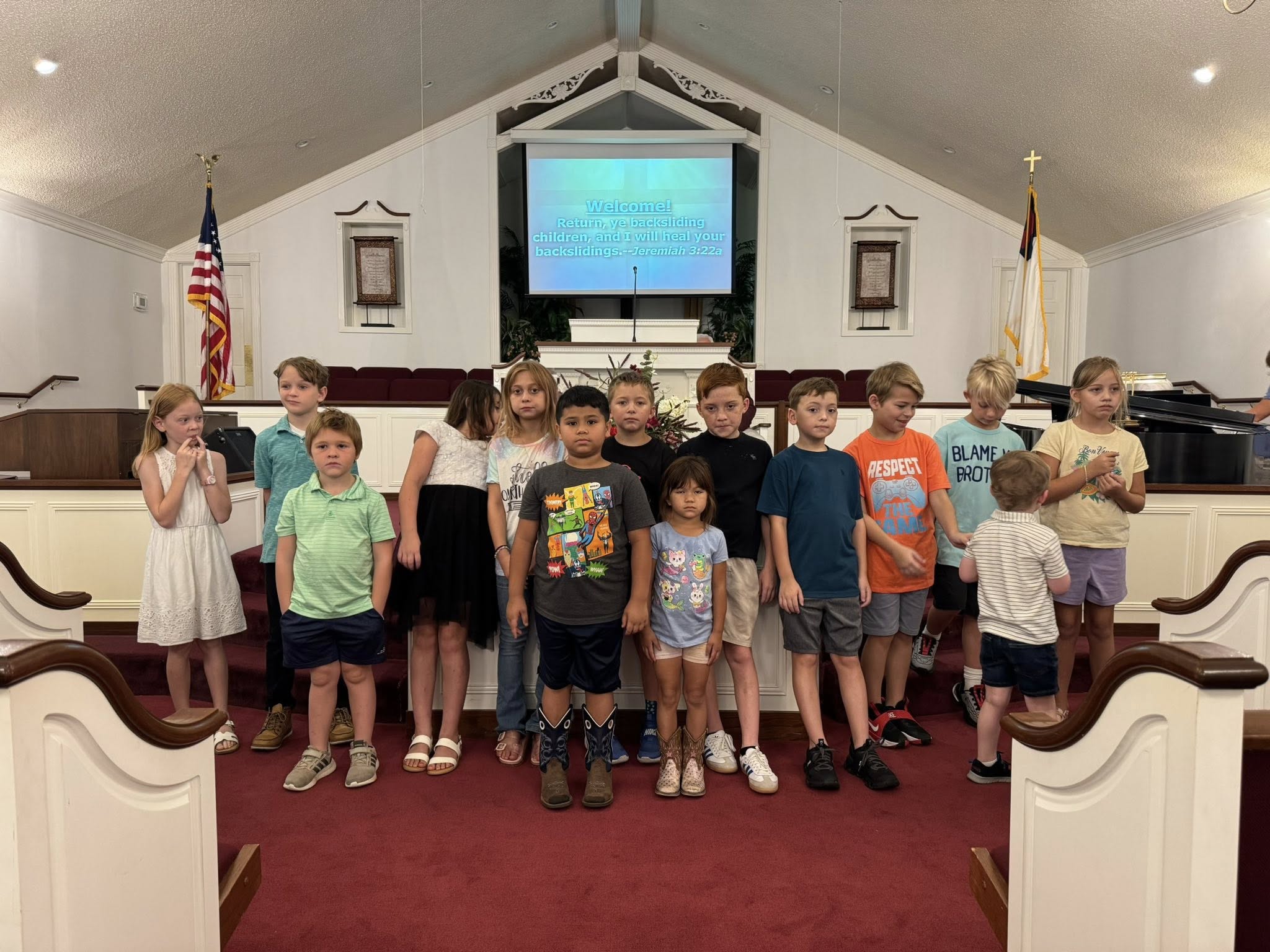Children singing together during a service