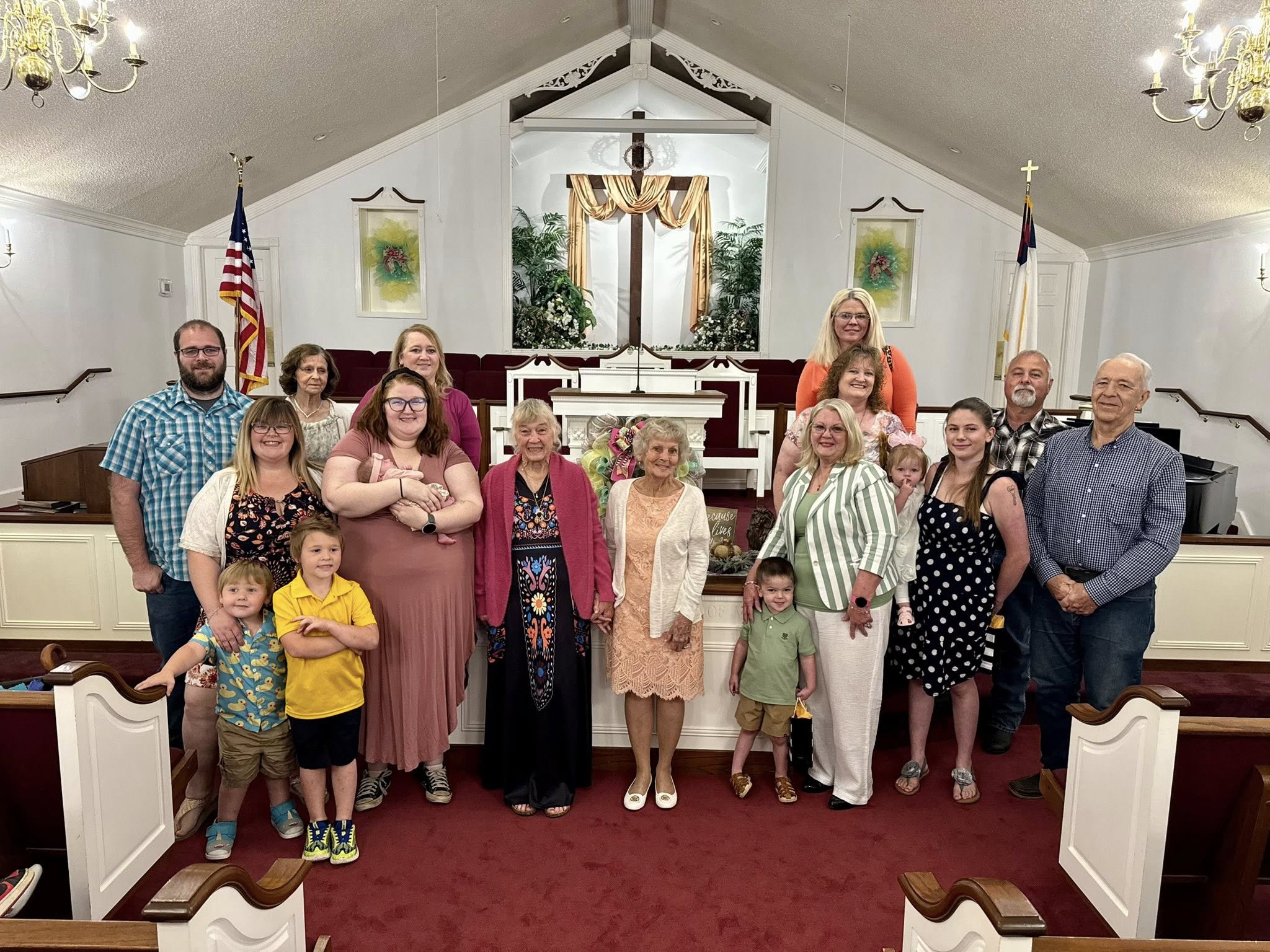 Members of the congregation gathered at the front of the sanctuary